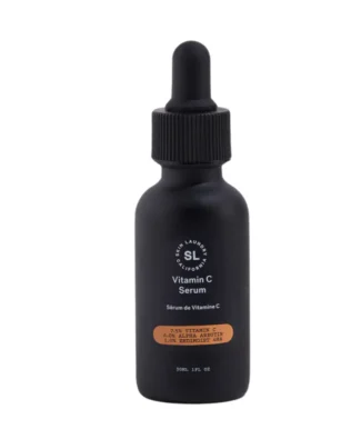 A black dropper bottle of Skin Laundry Vitamin C Serum, featuring "7.5% VITAMIN C 6.0% ALPHA ARBUTIN 1.0% ENDIMOIST® 4HA" on its label, presented against a white background.