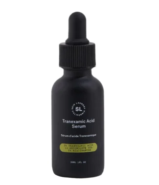 A black dropper bottle of Skin Laundry Tranexamic Acid Serum, highlighting "3% TRANEXAMIC ACID 1% ENDIMOIST® 4HA & 2% NIACINAMIDE" on its label, against a white background.