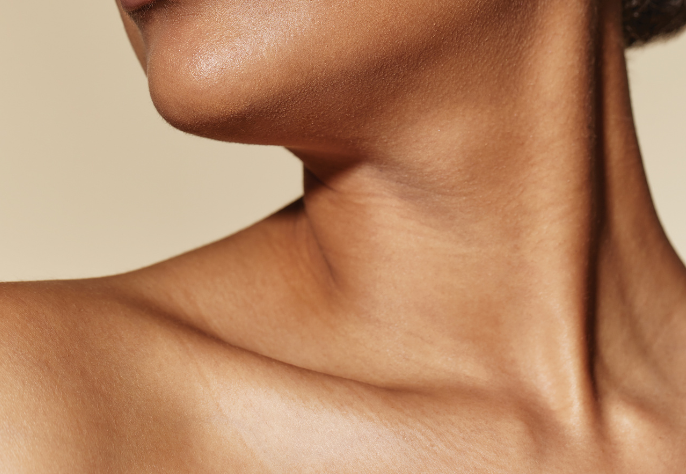 Close-up of a woman's smooth neck and collarbone after laser skin rejuvenation at Skin Laundry UAE
