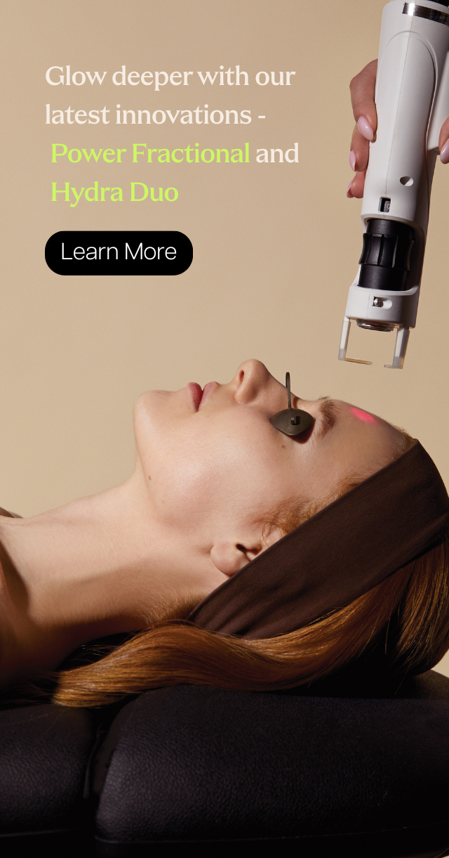 Woman receiving Power Fractional laser facial treatment at Skin Laundry UAE clinic.