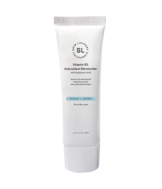 A white tube of Skin Laundry Vitamin B5 Antioxidant Moisturizer with Hyaluronic Acid, featuring the brand logo and product name, with text "HYDRATE + PROTECT" and "For all skin types." The tube is shown upright against a white background.