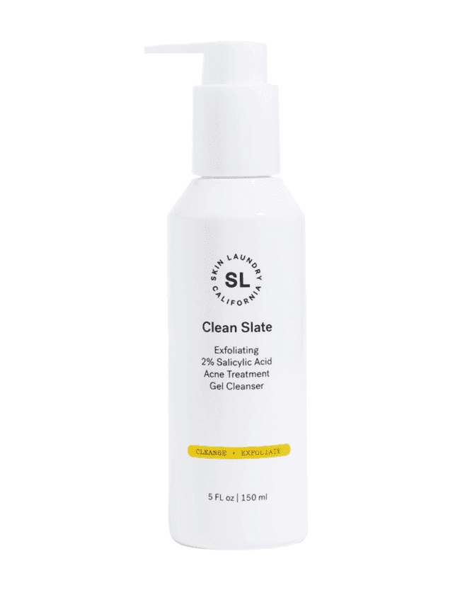 A white pump bottle of Skin Laundry "Clean Slate" Exfoliating 2% Salicylic Acid Acne Treatment Gel Cleanser, with a yellow bar indicating it helps "CLEANSE + EXFOLIATE."